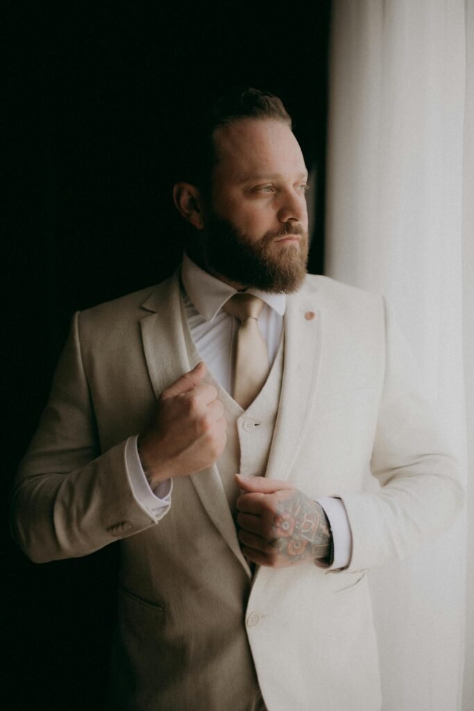 man wearing beige suit