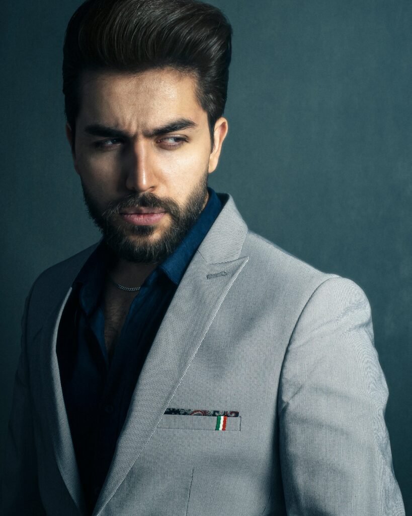Close up of man in grey suit focusing the shoulders