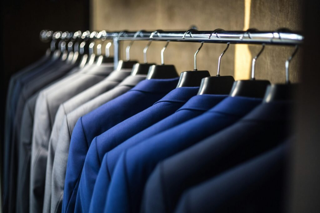 Different color men suits on hangers
