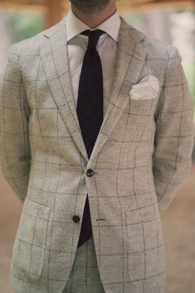 Man wearing suit, tie and pocket square